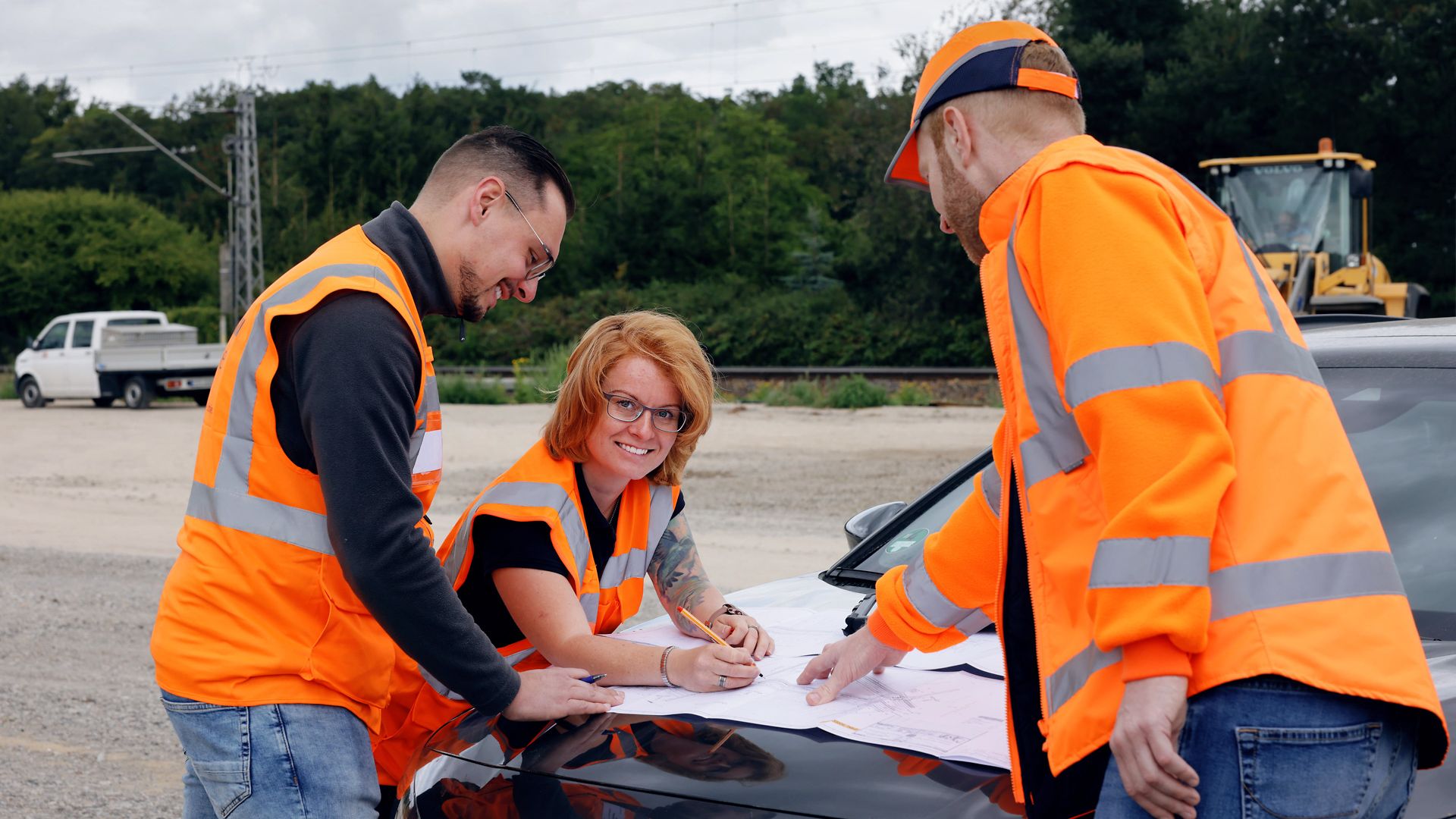 Three staff members from the equipment planning department