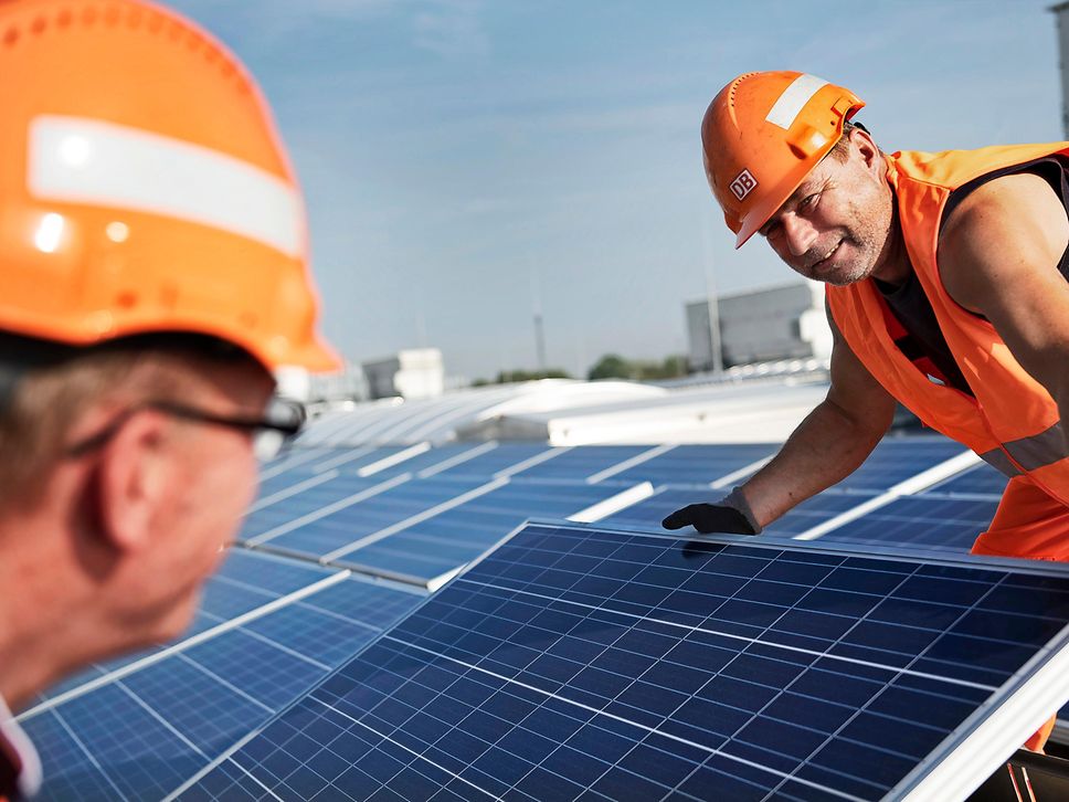 Staff are installing photovoltaic panels